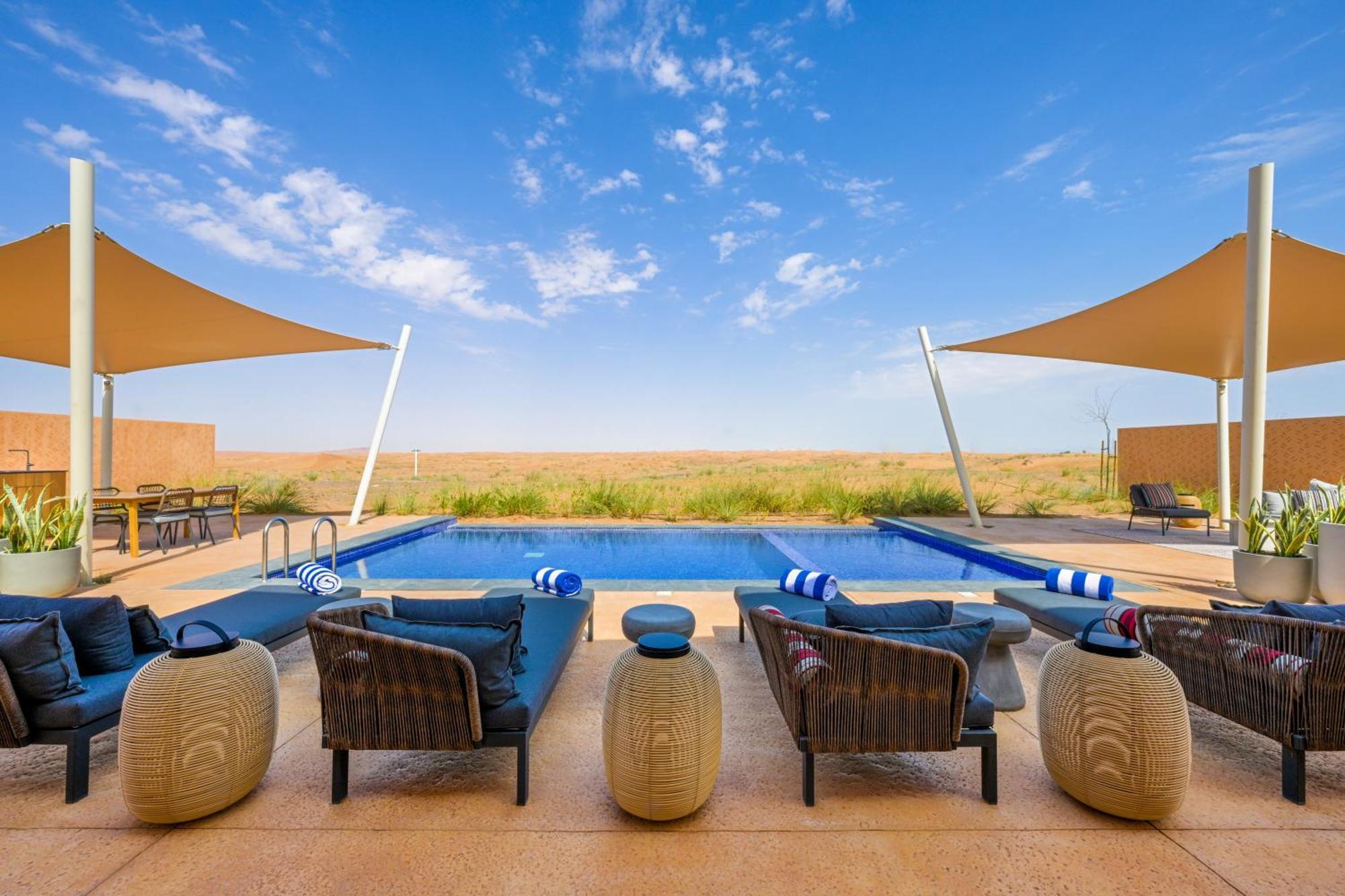Отель Al Badayer Retreat By Sharjah Collection Margham Экстерьер фото The pool at the Al Maha Desert Resort