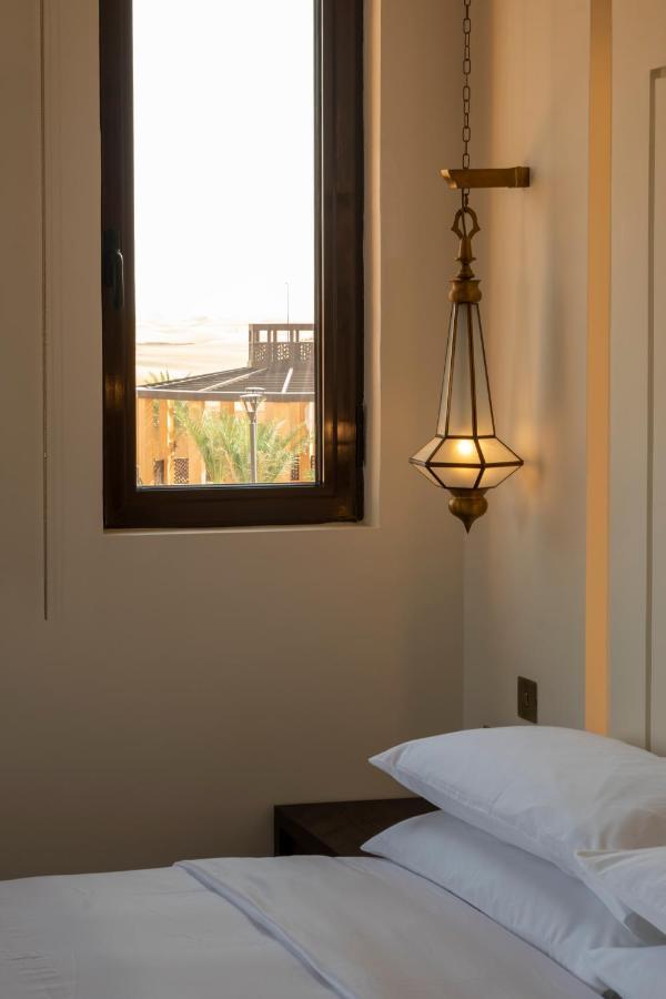 Отель Al Badayer Retreat By Sharjah Collection Margham Экстерьер фото A hanging lamp