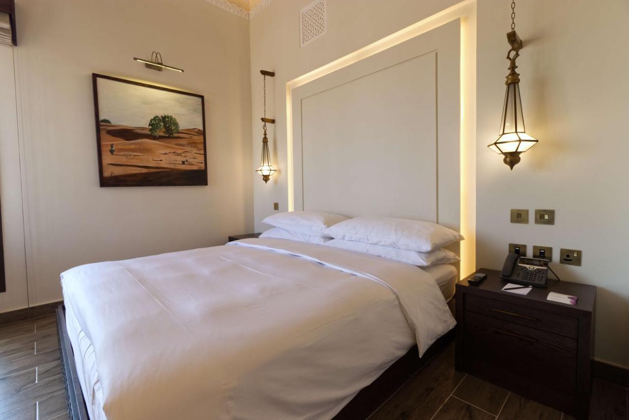 Отель Al Badayer Retreat By Sharjah Collection Margham Экстерьер фото A bedroom at the hotel